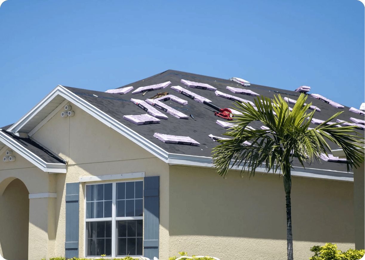 House roof under renovation with shingles