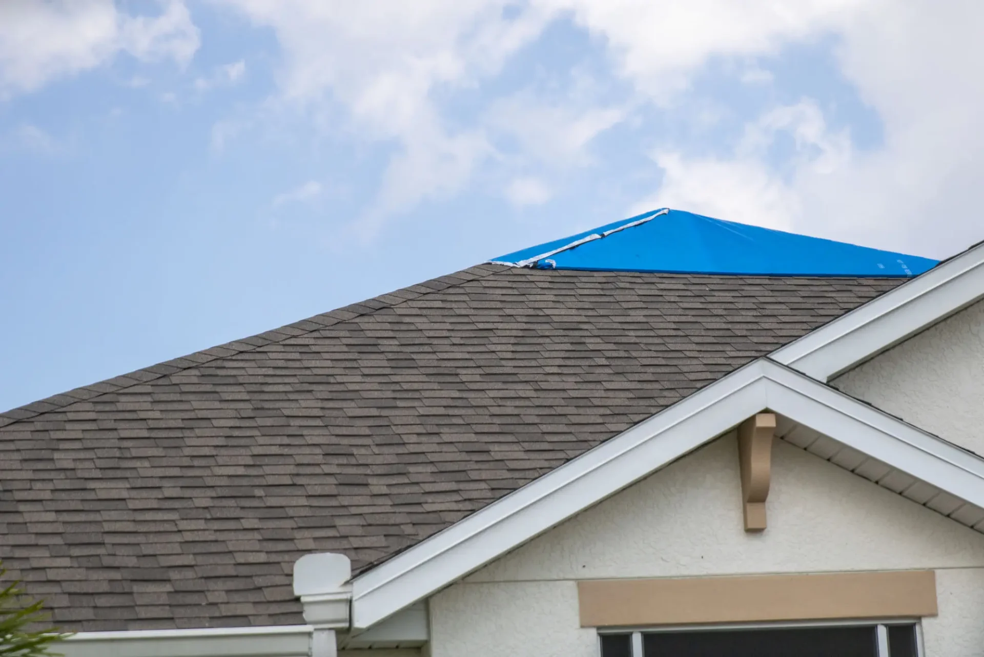 Temporary roof repair with tarp