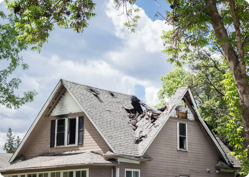 Damaged roof with missing shingles