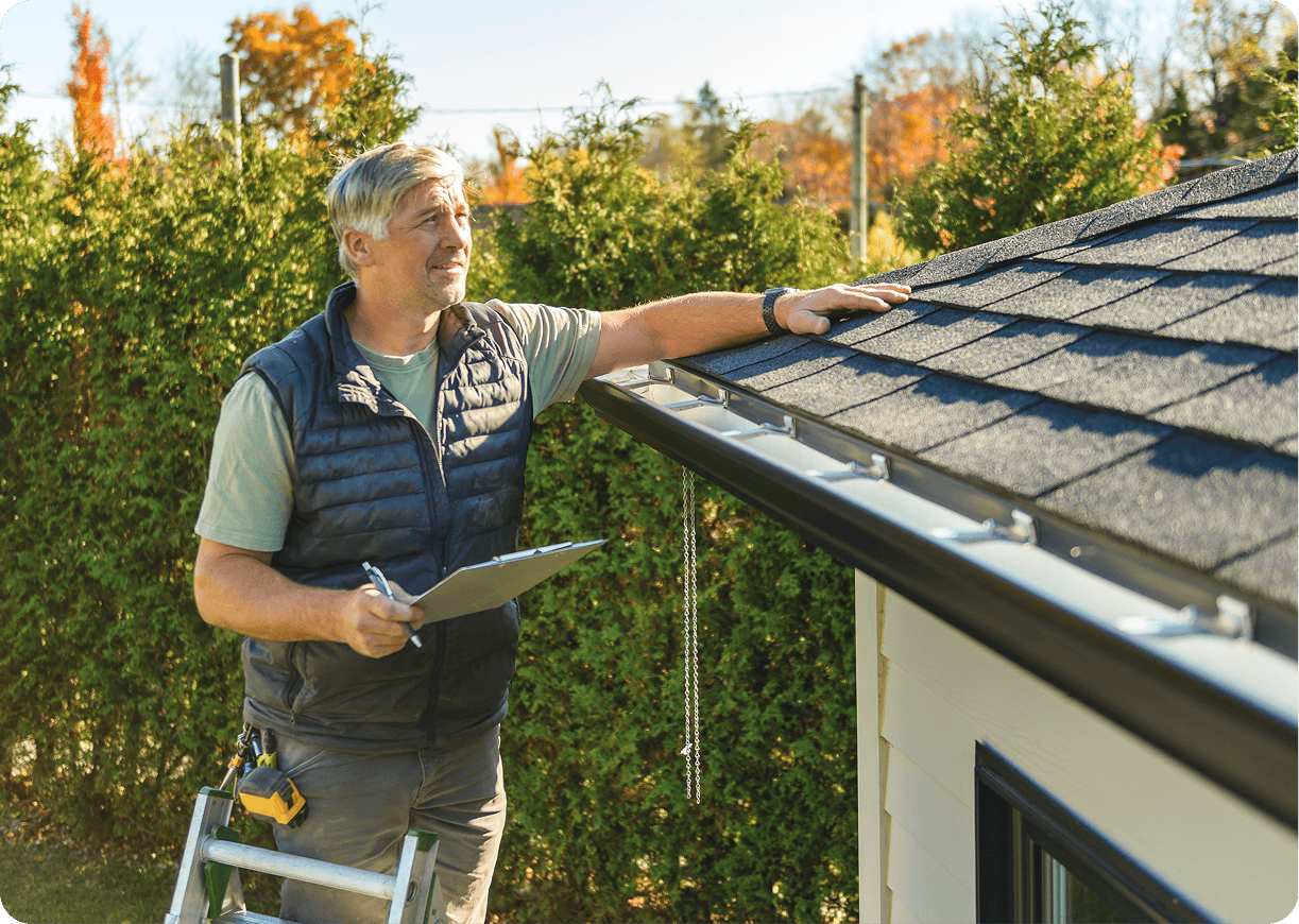 Person conducting roof maintenance inspection